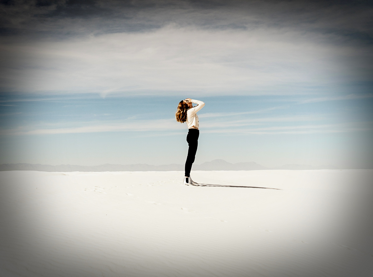 woman on white sand beach